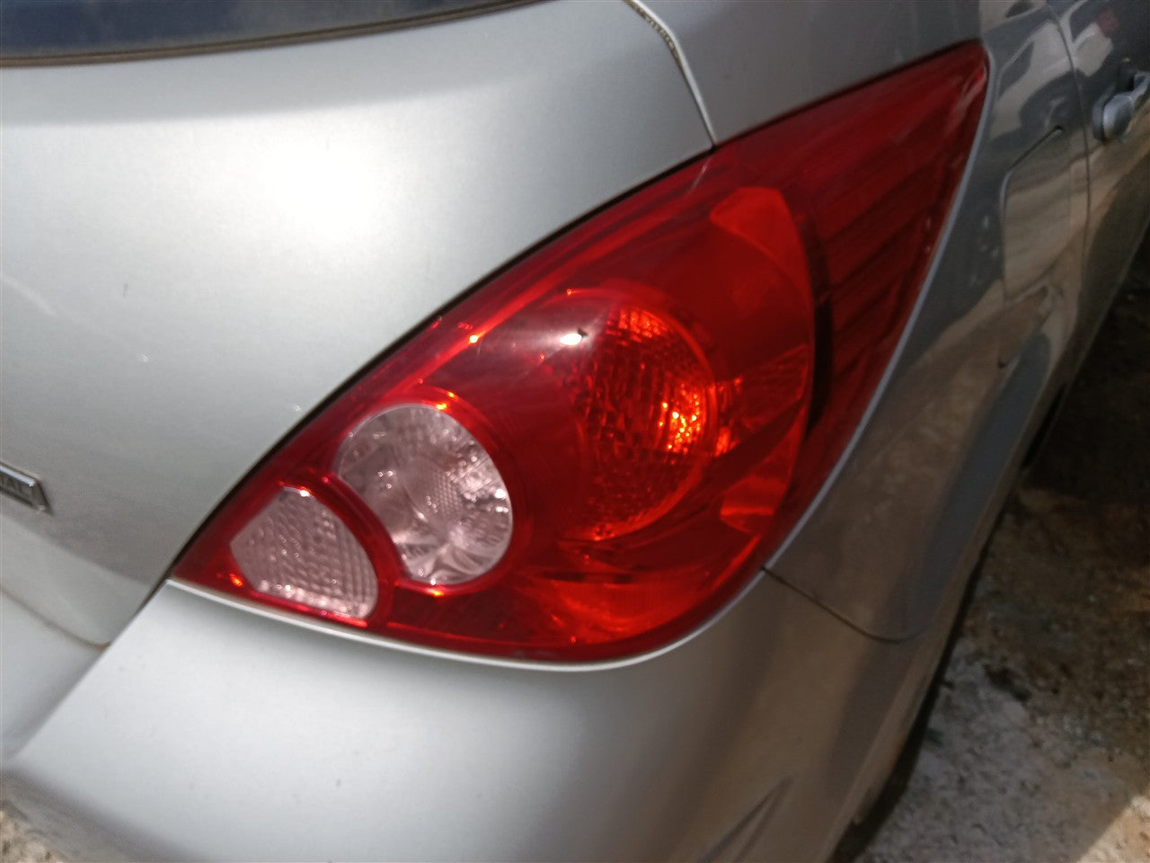 2007 thru 2012 Nissan Versa Passenger Side Right Tail Light Lamp Assembly quarter panel mounted Htbk R