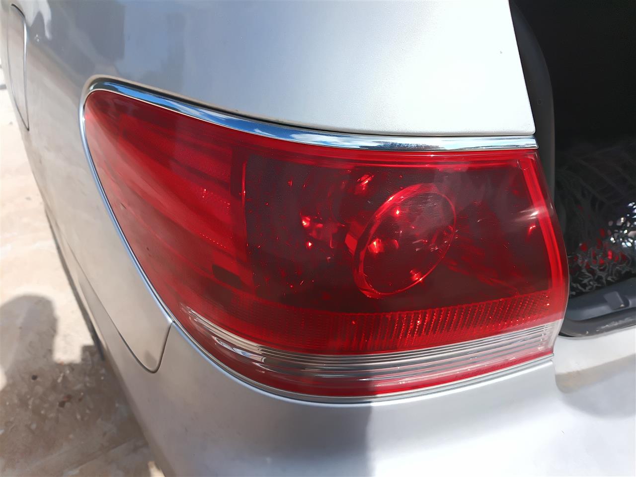 2002 thru 2006 Lexus ES330, Lexus ES300 Driver Side Left Tail Light Lamp Assembly quarter panel mounted L