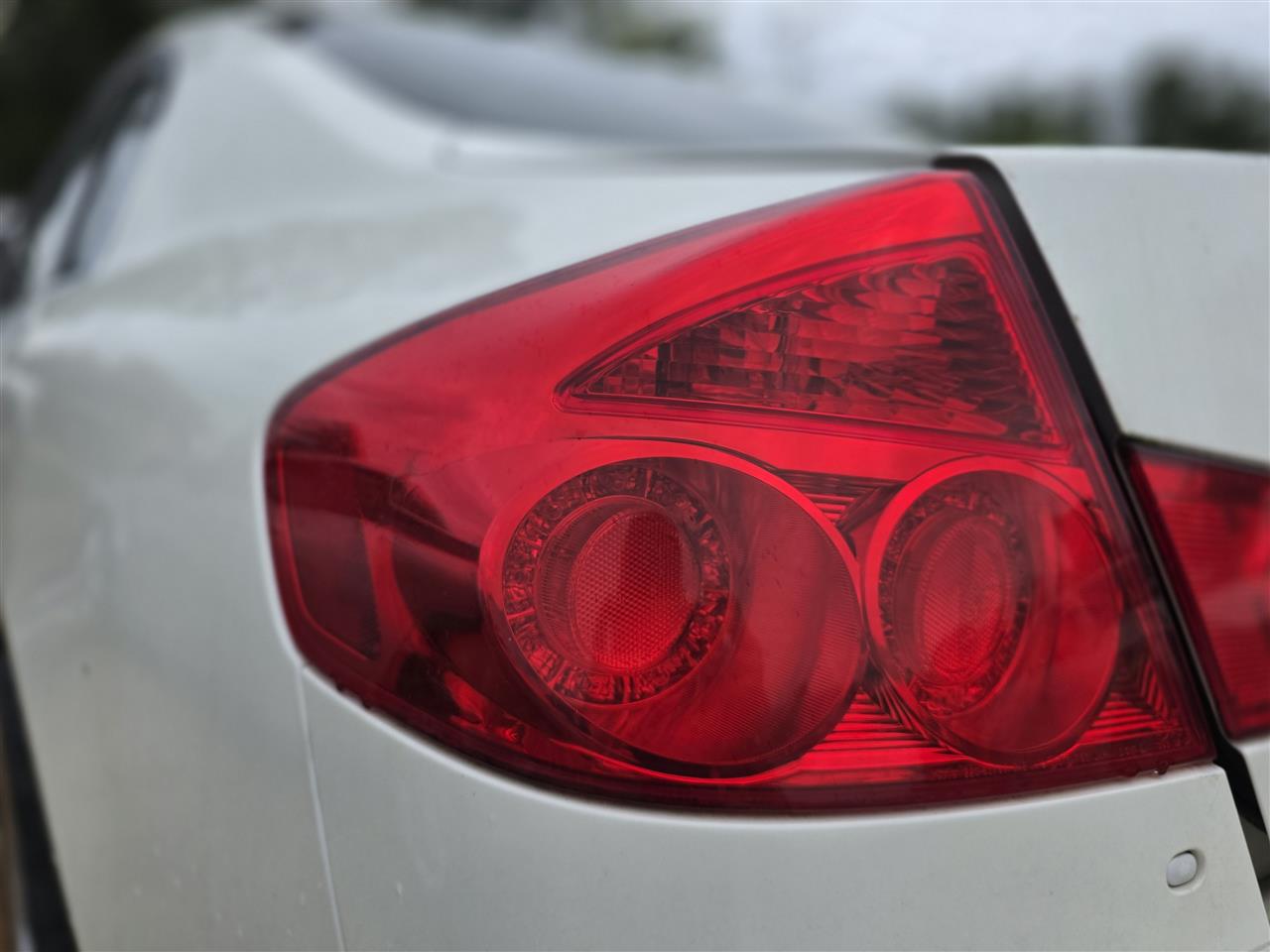 2005 2006 Infiniti G35 Driver Side Left Tail Light Lamp Assembly 4 Dr Sdn quarter panel mounted L
