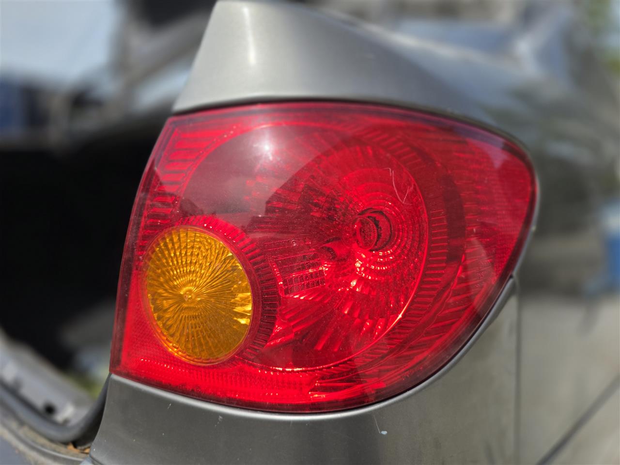 2003 thru 2008 Toyota Corolla Passenger Side Right Tail Light Lamp Assembly quarter panel mounted R