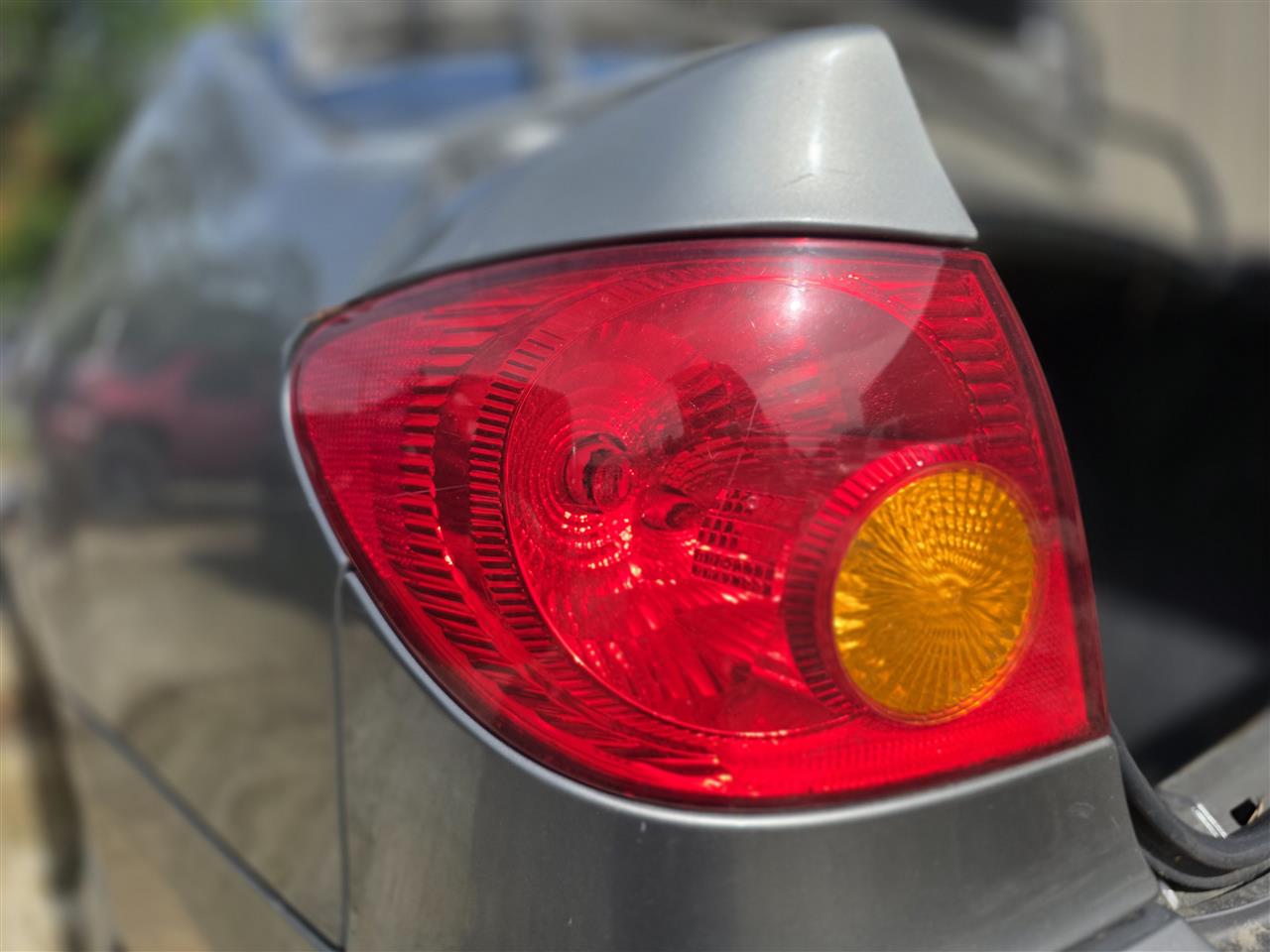 2003 thru 2008 Toyota Corolla Driver Side Left Tail Light Lamp Assembly quarter panel mounted L