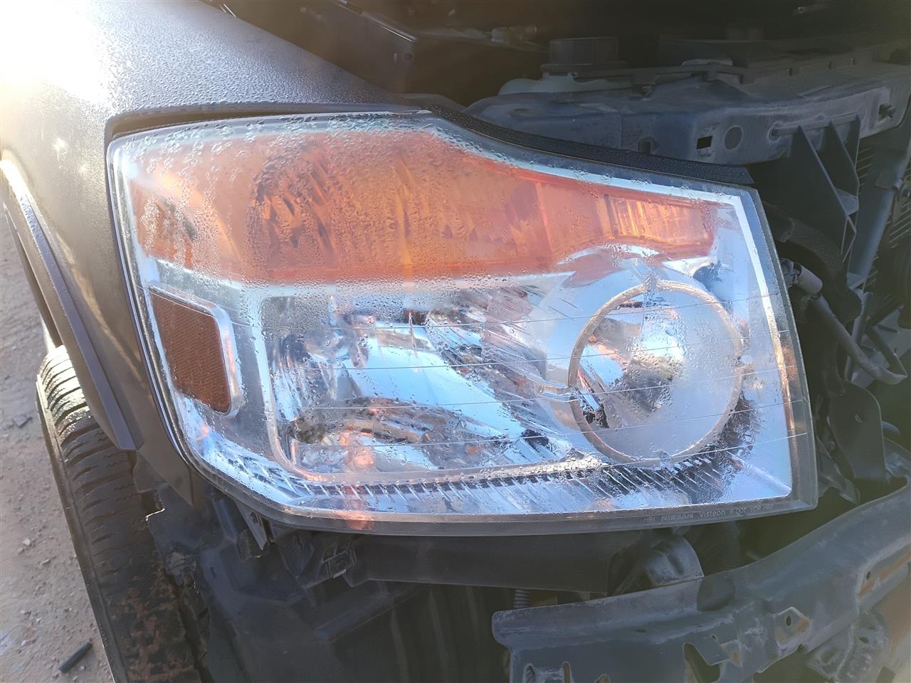 Used OEM Passenger Side Right Headlight Headlamp Assembly from 2014 Nissan Armada