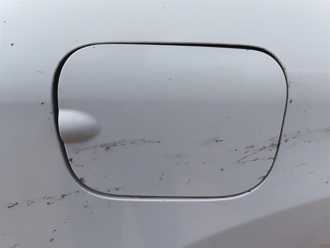 Used OEM Fuel Filler Gas Door Lid from 2009 Nissan Rogue