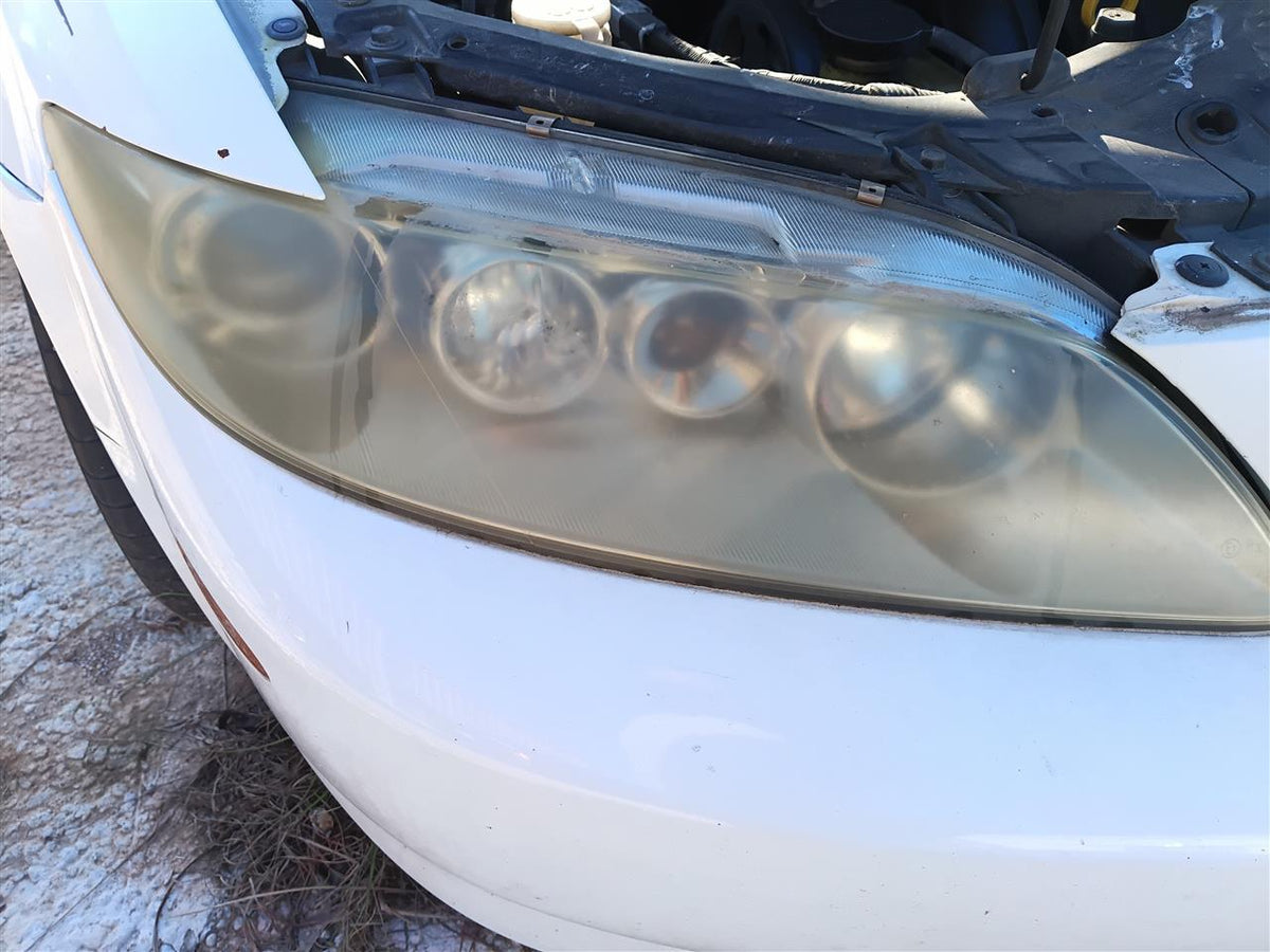 Used OEM Passenger Side Right Headlight Headlamp Assembly from 2005 Mazda 6