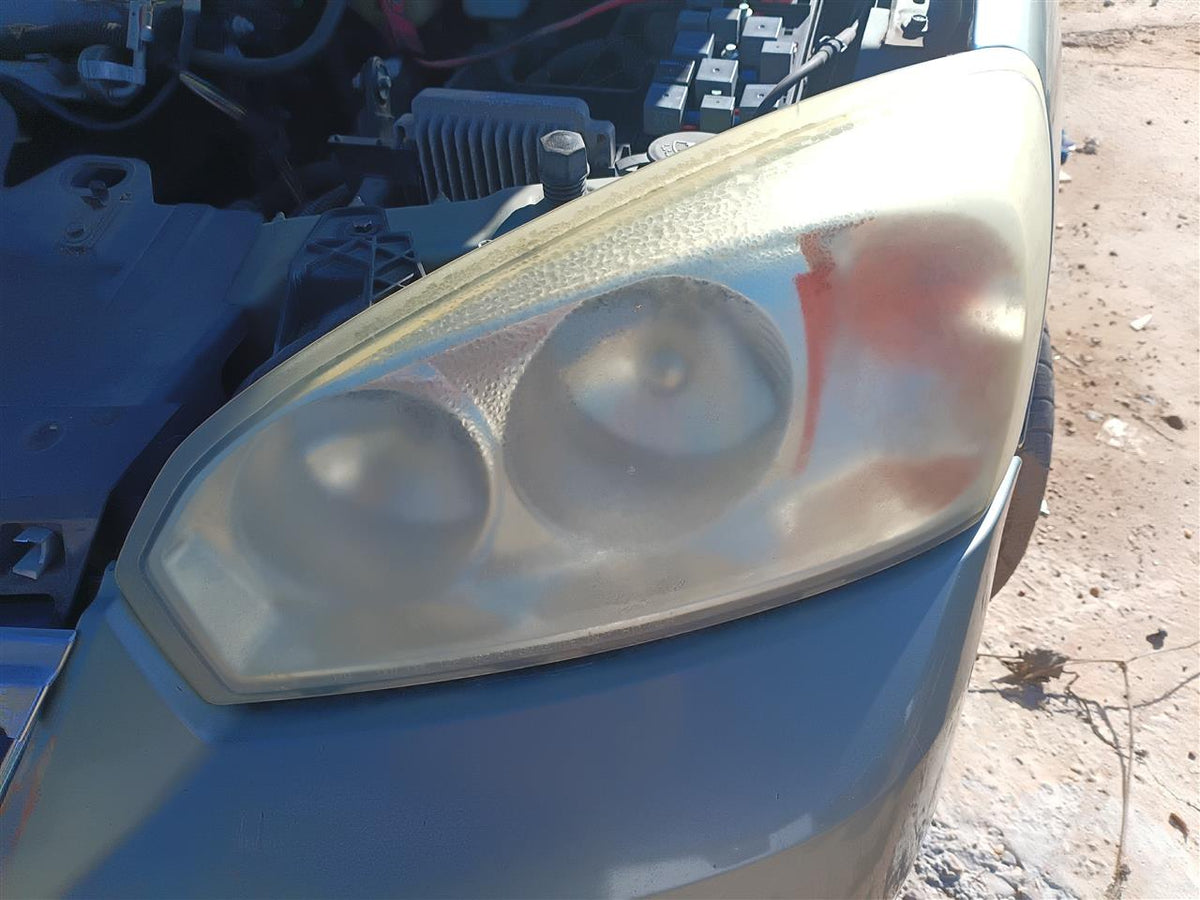 Used OEM Driver Side Left Headlight Headlamp Assembly from 2006 Chevrolet Malibu