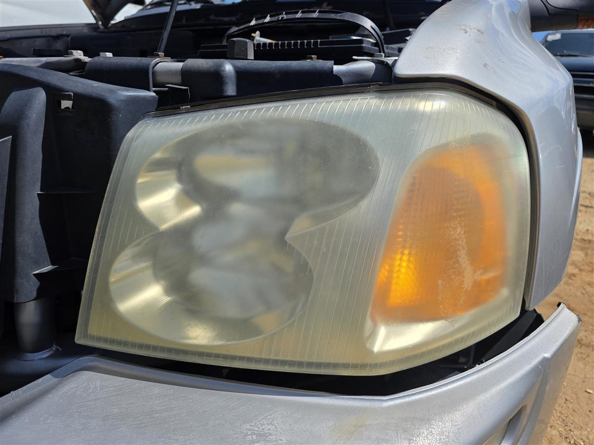 Used OEM Driver Side Left Headlight Headlamp Assembly from 2004 GMC Envoy XUV