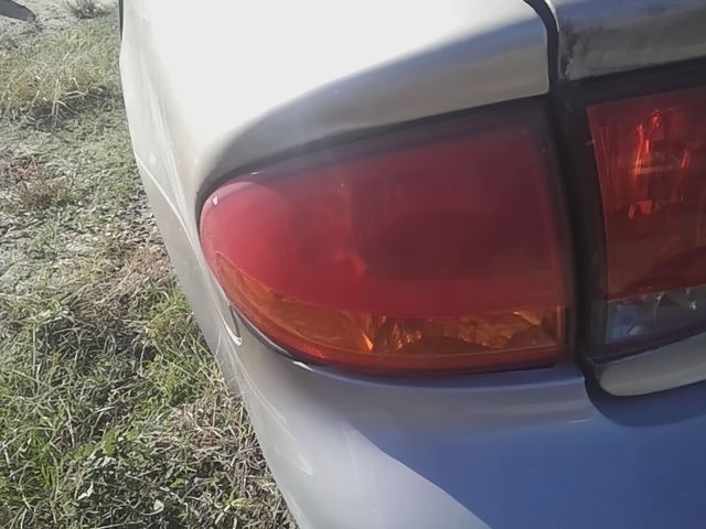 1999 thru 2004 Oldsmobile Alero Driver Side Left Tail Light Lamp Assembly quarter panel mounted L