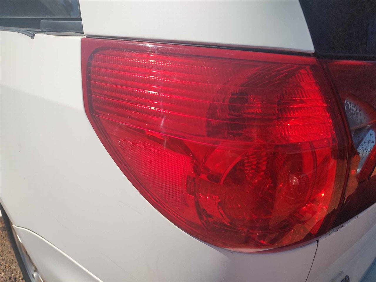 2006 thru 2010 Toyota Sienna Driver Side Left Tail Light Lamp Assembly quarter panel mounted L