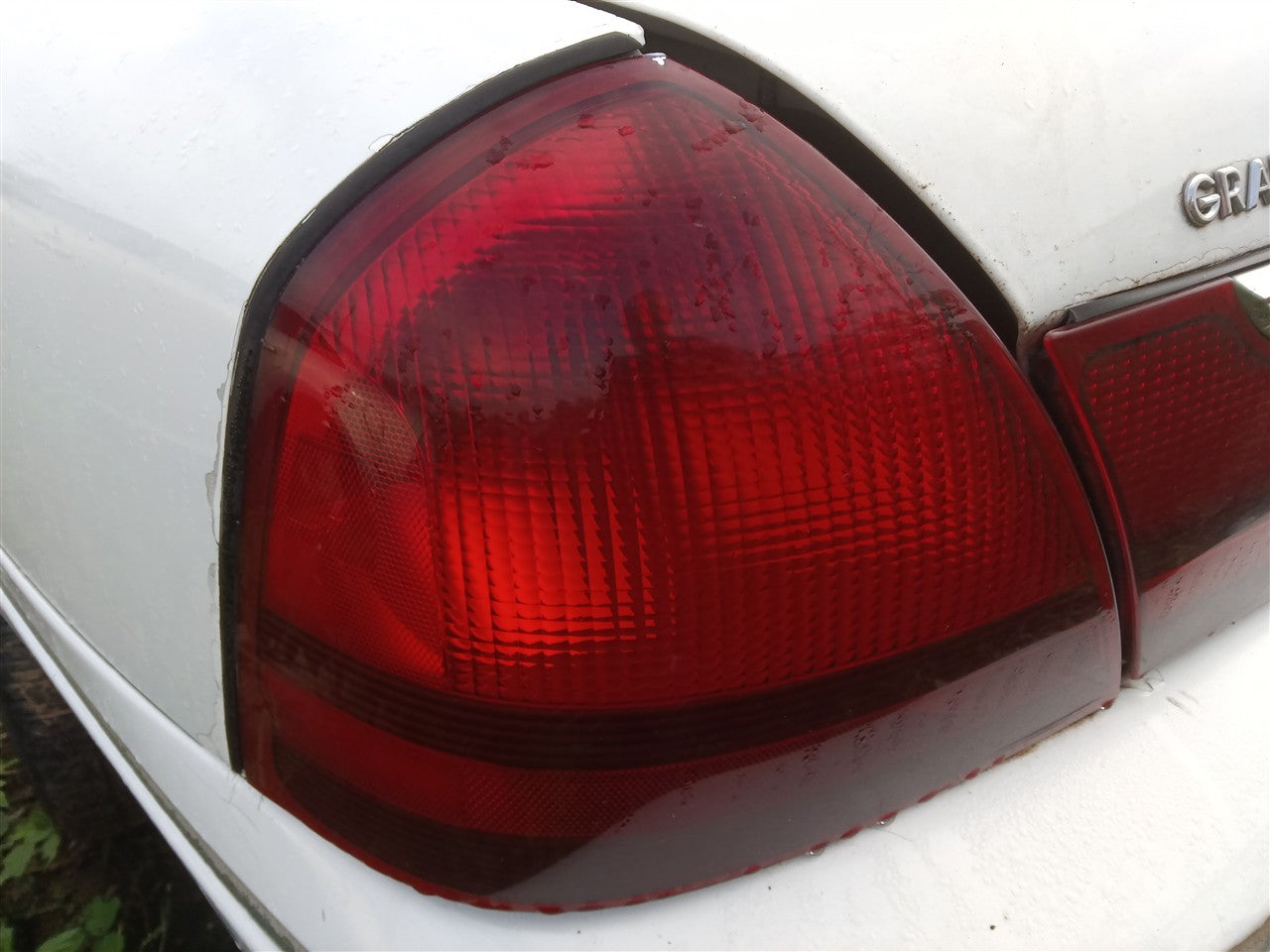 2003 thru 2011 Mercury Grand Marquis, Mercury Marauder Driver Side Left Tail Light Lamp Assembly quarter panel mounted L