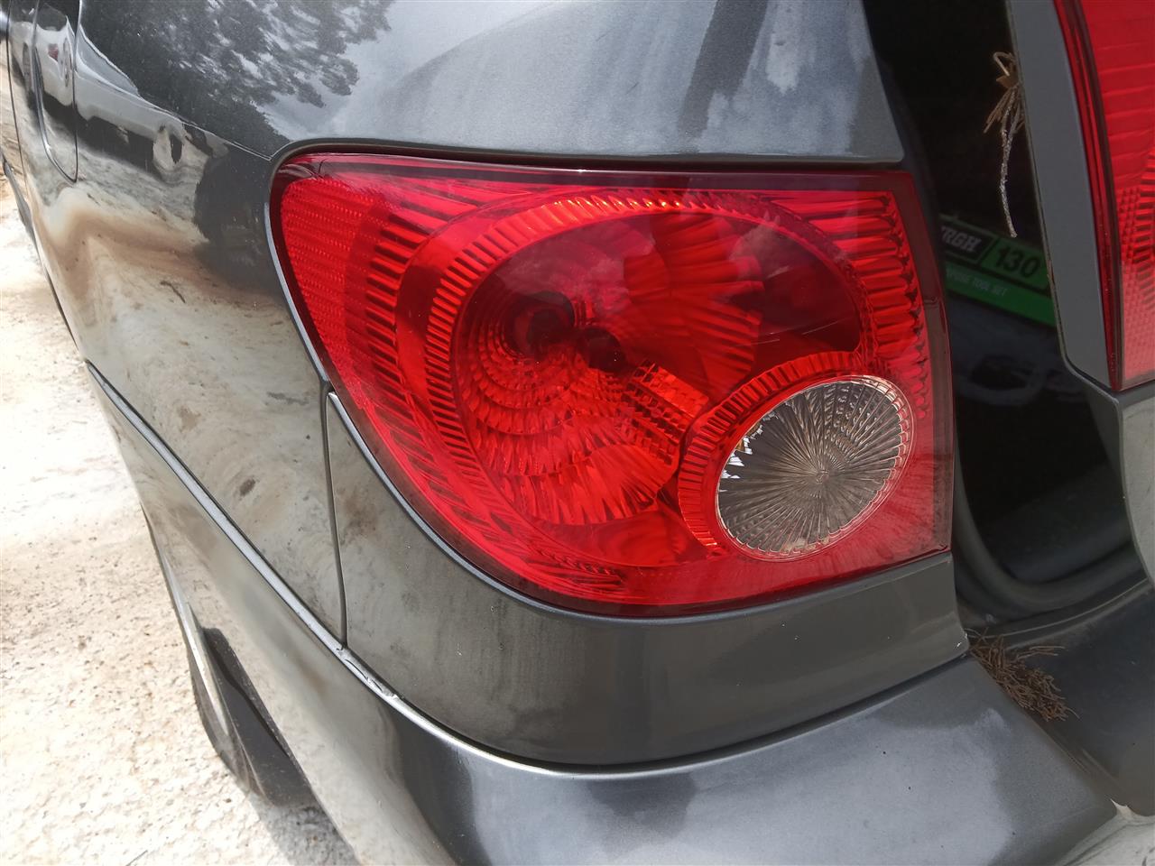 2003 thru 2008 Toyota Corolla Driver Side Left Tail Light Lamp Assembly quarter panel mounted L