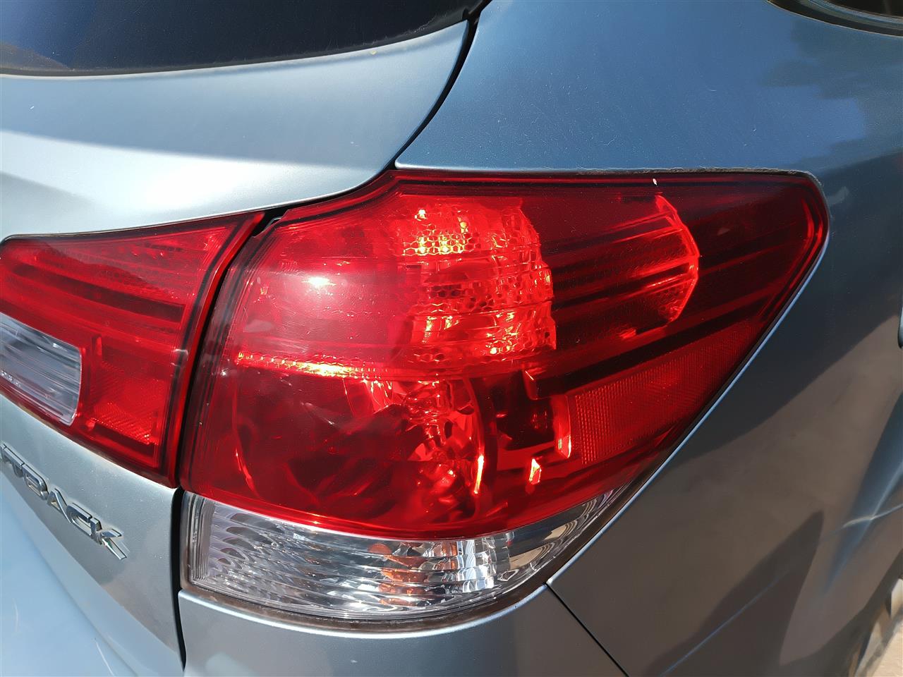 2010 thru 2014 Subaru Legacy Passenger Side Right Tail Light Lamp Assembly quarter panel mounted R