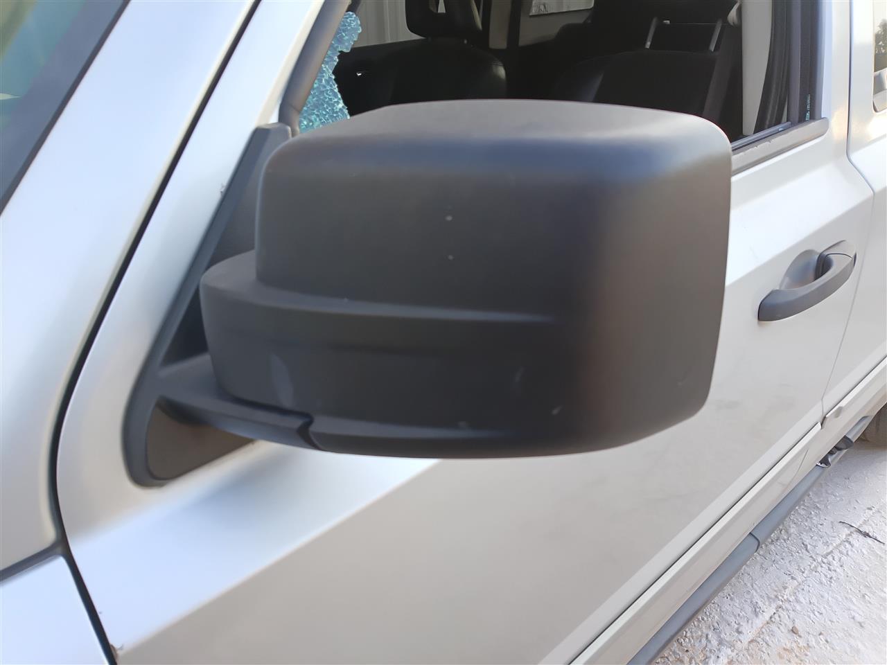2007 thru 2012 Jeep Patriot Left Driver Side View Door Mirror moulded in black power non heated L