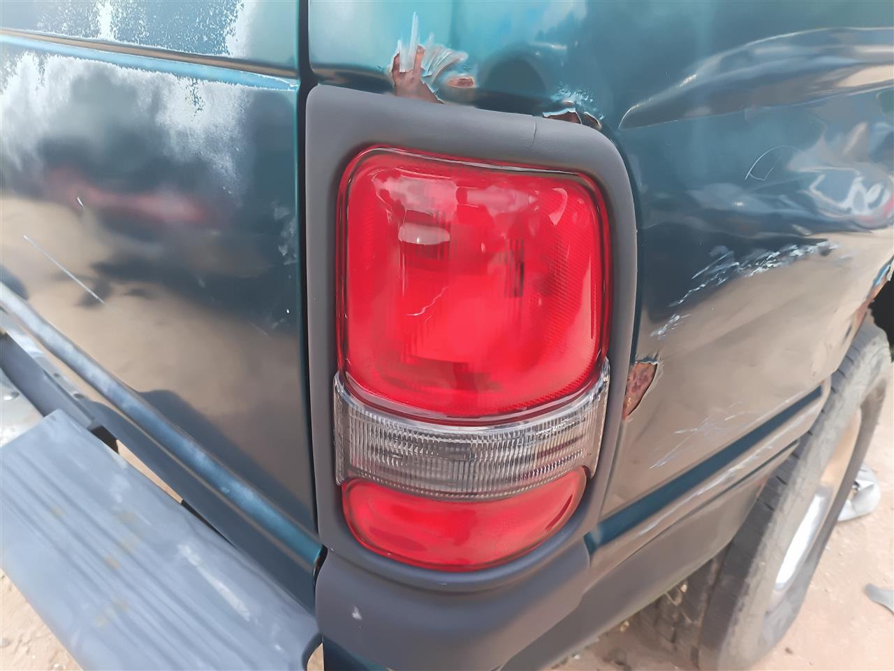 Used OEM Passenger Side Right Tail Light Lamp Assembly from 1998 Dodge 1500