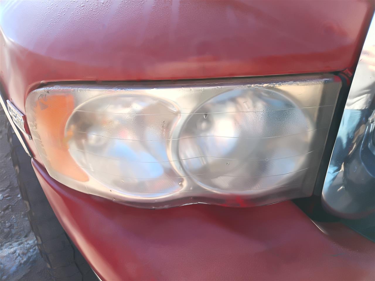 Used OEM Passenger Side Right Headlight Headlamp Assembly from 2004 Dodge 1500