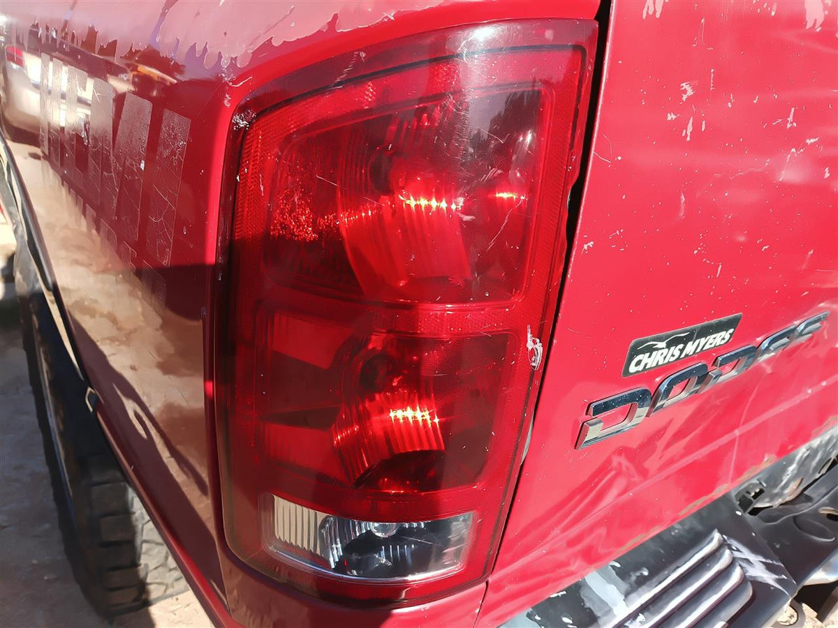 Used OEM Driver Side Left Tail Light Lamp Assembly from 2004 Dodge 1500