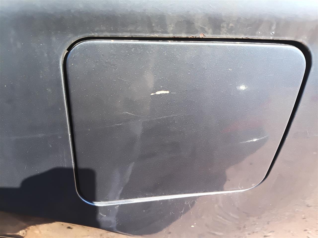 Used OEM Fuel Filler Gas Door Lid from 2008 Nissan Altima