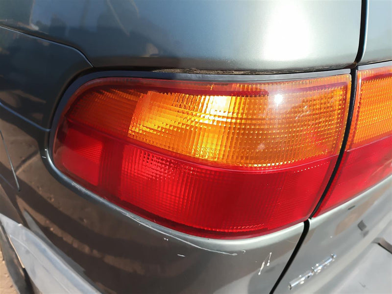 Used OEM Driver Side Left Tail Light Lamp Assembly from 2000 Toyota Sienna