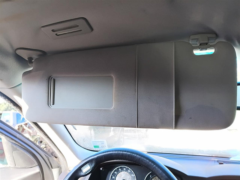 Used OEM Driver Side Left Sun Visor from 2006 BMW 750I
