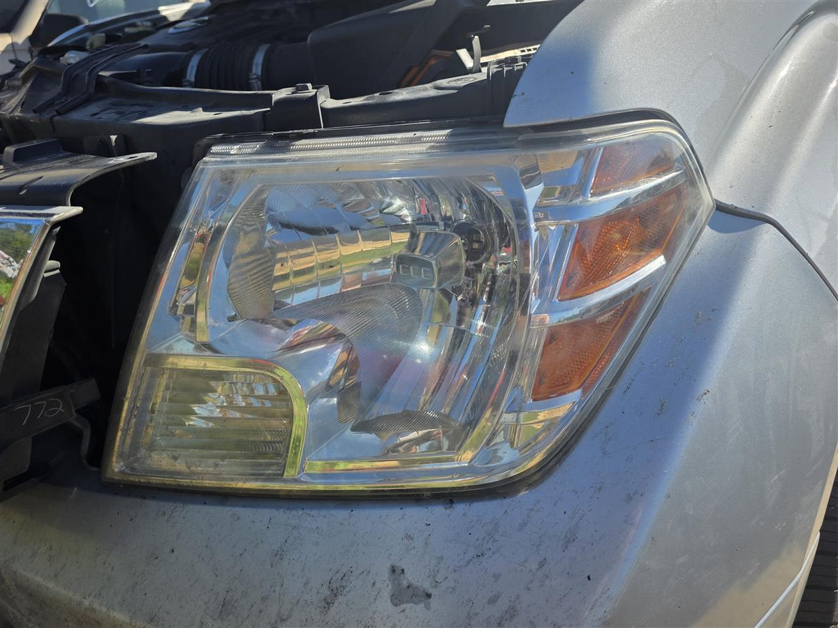 Used OEM Driver Side Left Headlight Headlamp Assembly from 2014 Nissan Frontier