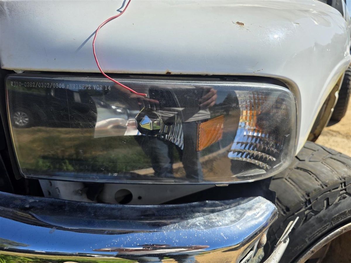 Used OEM Driver Side Left Headlight Headlamp Assembly from 2001 Dodge 1500