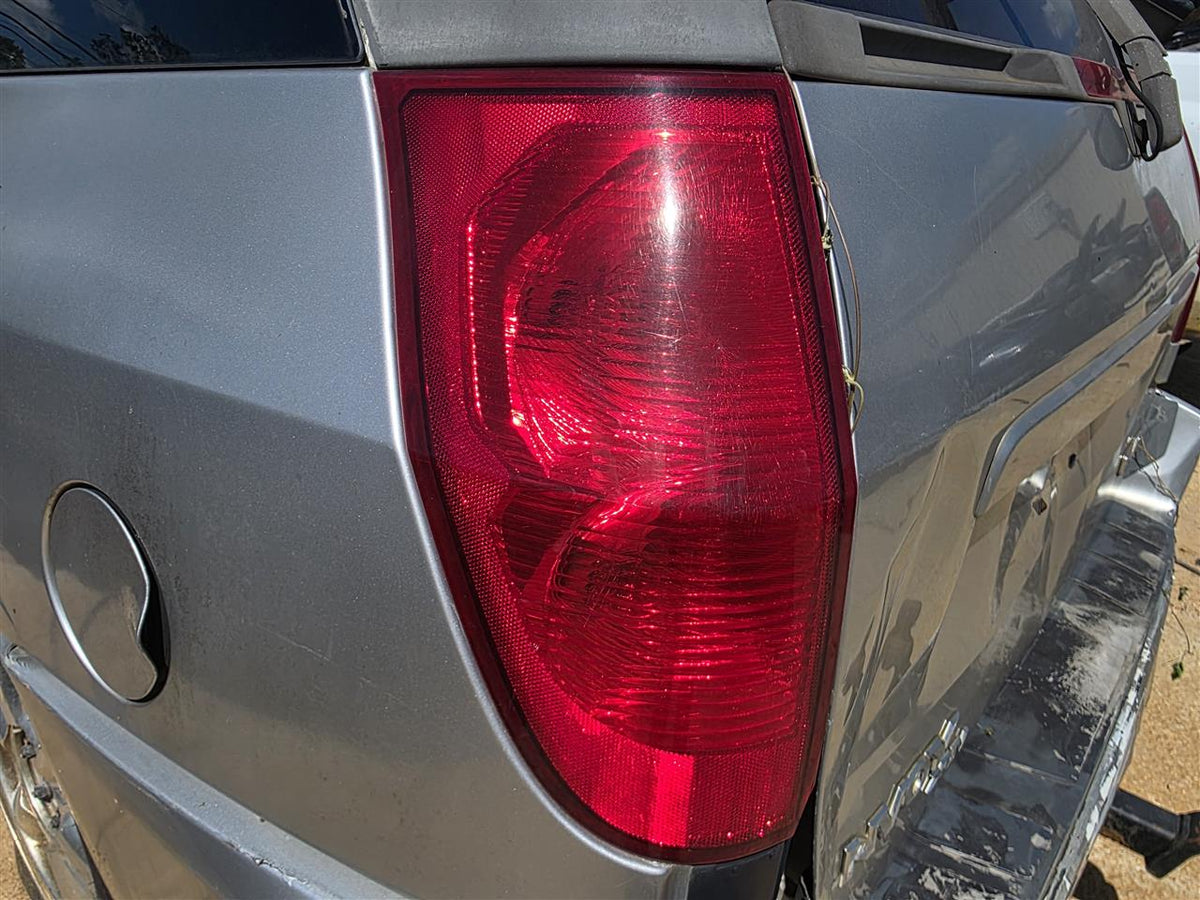 Used OEM Driver Side Left Tail Light Lamp Assembly from 2004 GMC Envoy XUV