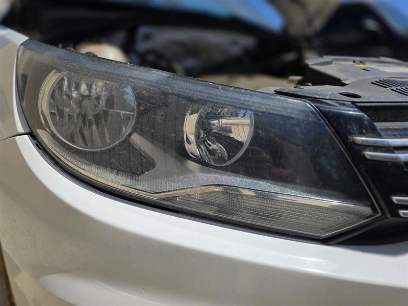 Used OEM Passenger Side Right Headlight Headlamp Assembly from 2014 Volkswagen Tiguan