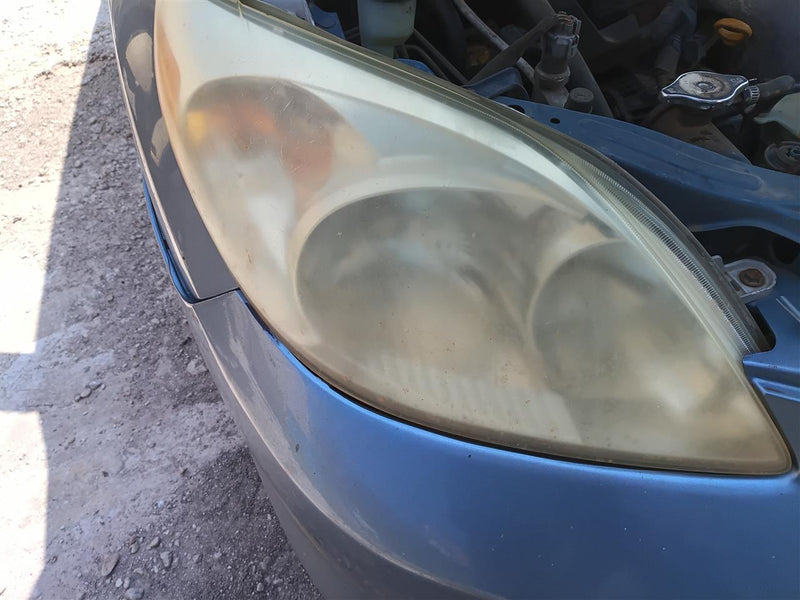 Used OEM Passenger Side Right Headlight Headlamp Assembly from 2003 Toyota Matrix