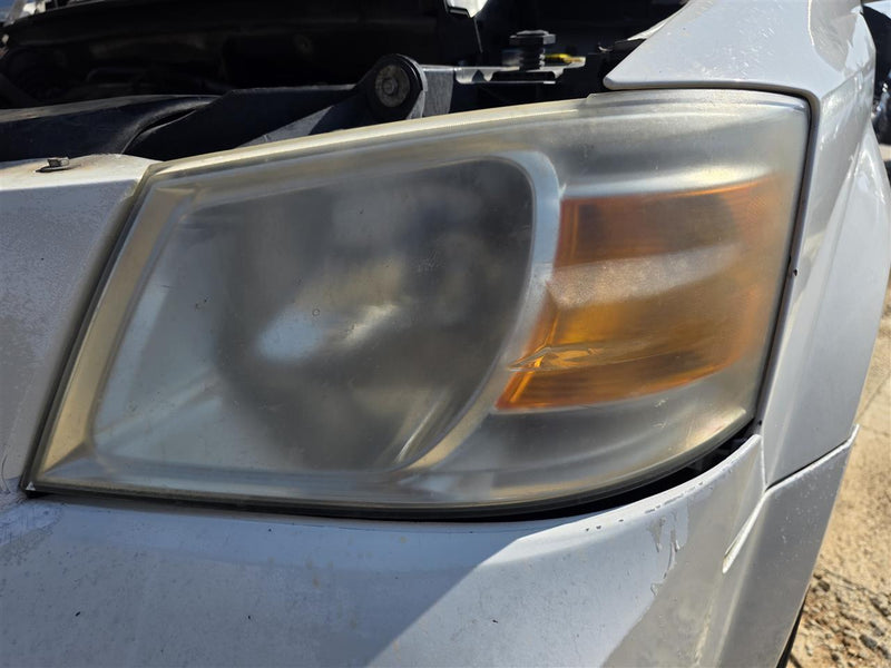Used OEM Driver Side Left Headlight Headlamp Assembly from 2008 Dodge Caravan
