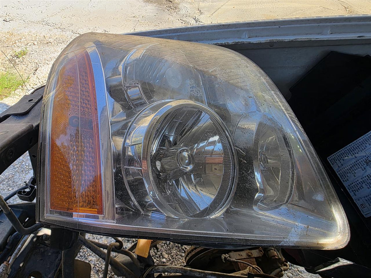 Used OEM Passenger Side Right Headlight Headlamp Assembly from 2007 GMC