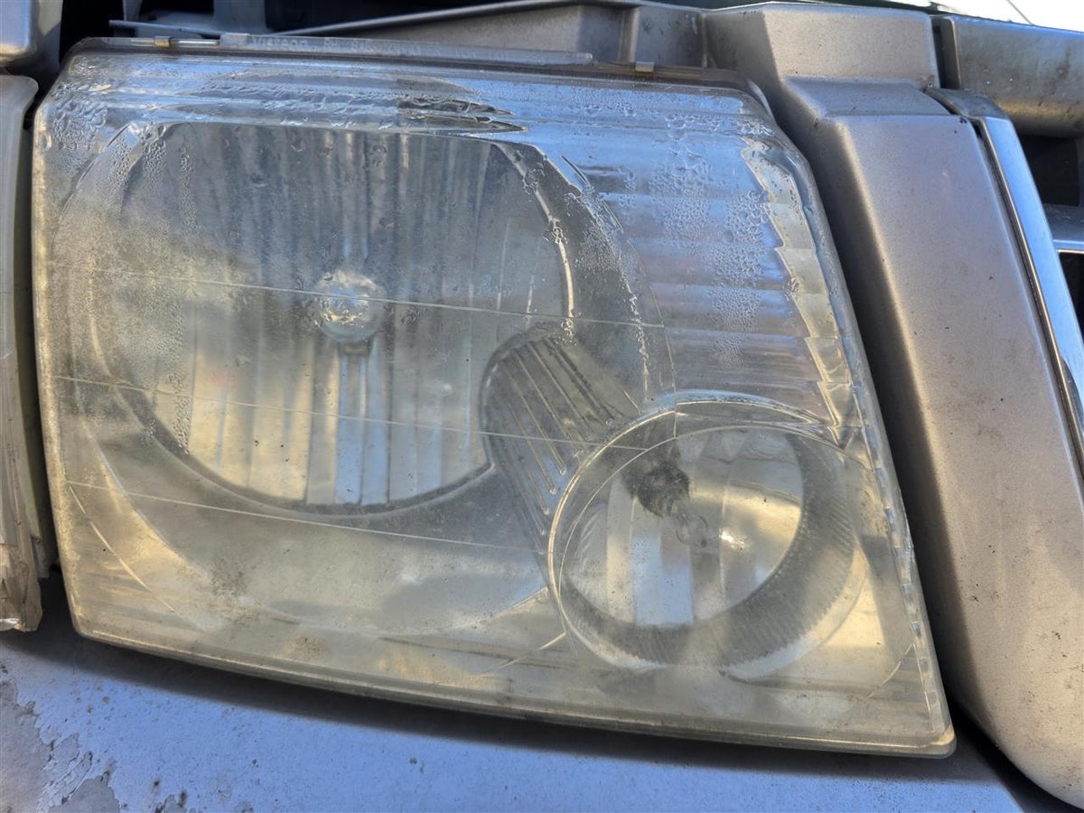Used OEM Passenger Side Right Headlight Headlamp Assembly from 2004 Ford Explorer