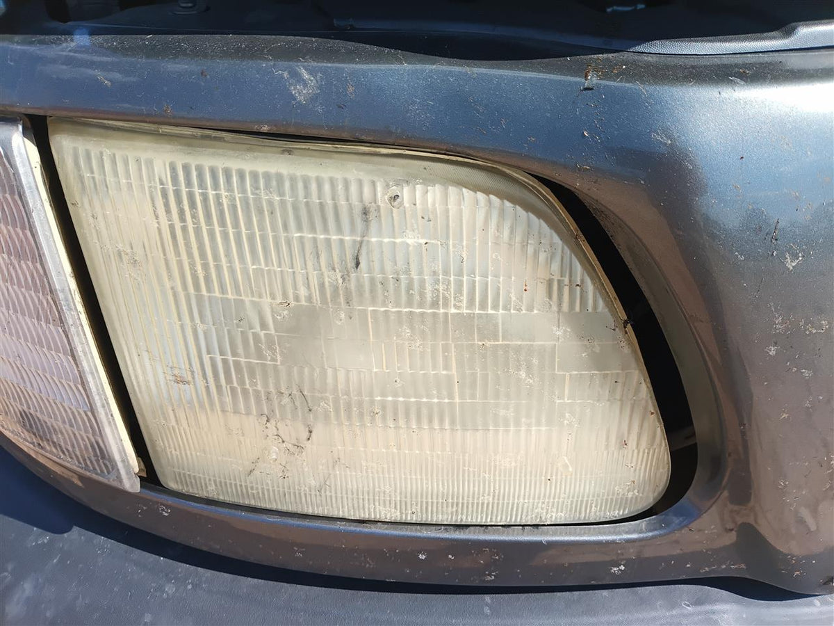 Used OEM Passenger Side Right Headlight Headlamp Assembly from 2002 Ford F150