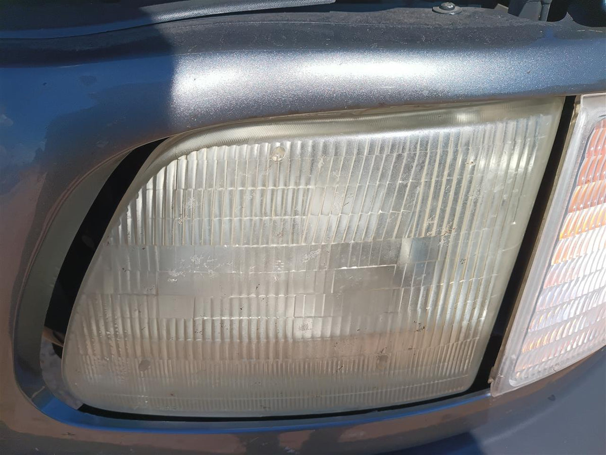 Used OEM Driver Side Left Headlight Headlamp Assembly from 2002 Ford F150