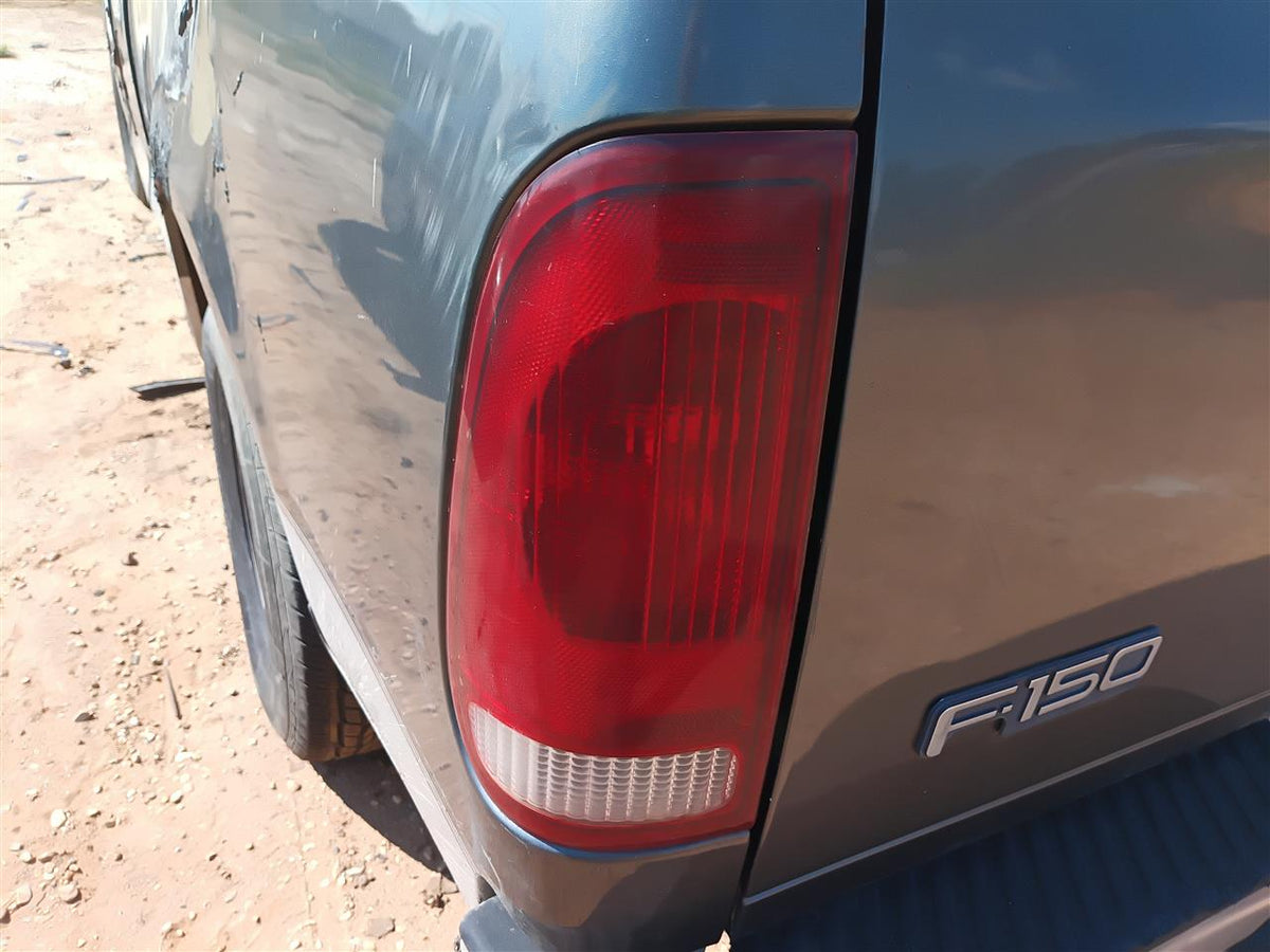 Used OEM Driver Side Left Tail Light Lamp Assembly from 2002 Ford F150