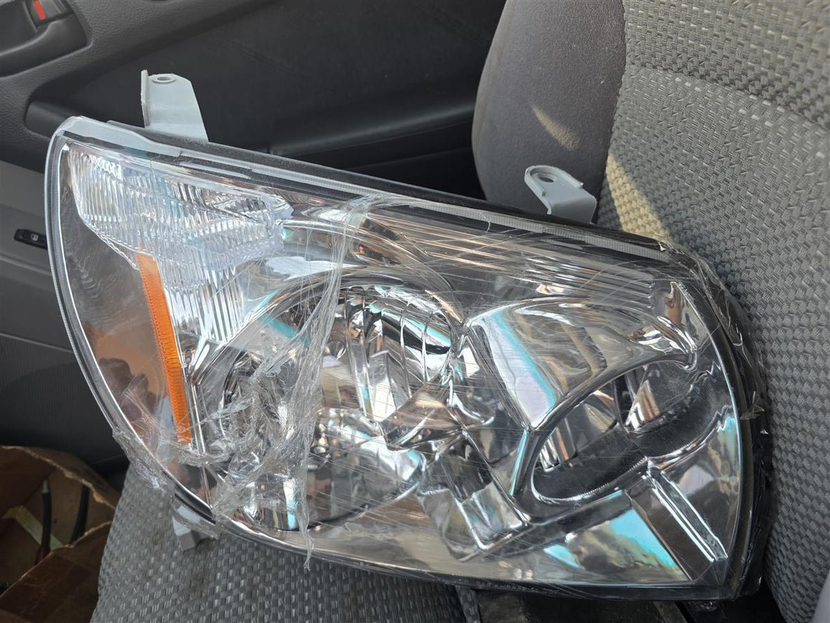 Used OEM Passenger Side Right Headlight Headlamp Assembly from 2003 Toyota 4 Runner