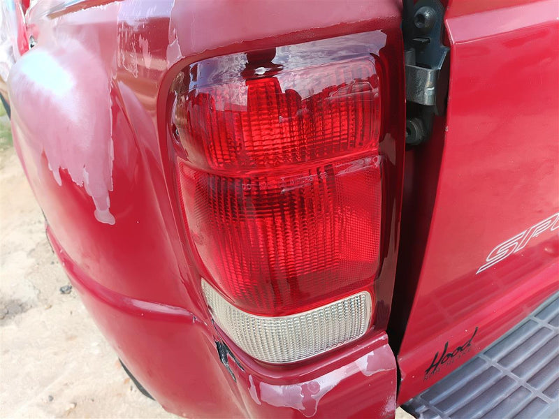 Used OEM Driver Side Left Tail Light Lamp Assembly from 2000 Ford Ranger