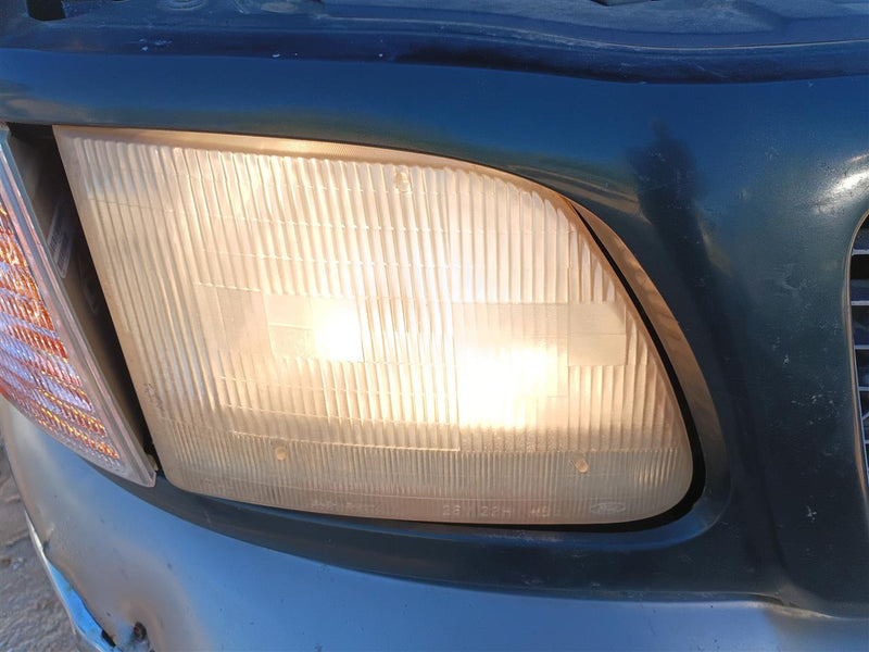 Used OEM Passenger Side Right Headlight Headlamp Assembly from 2001 Ford F150
