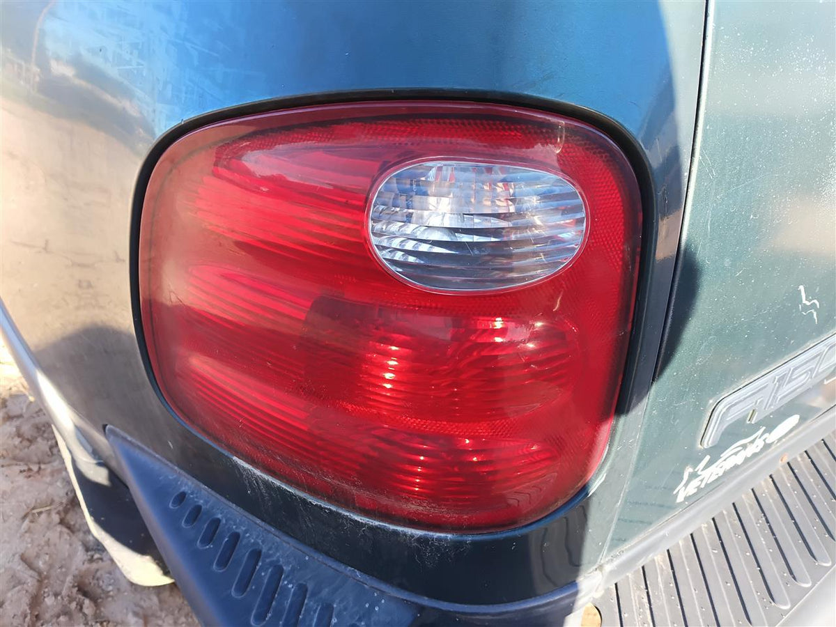 Used OEM Driver Side Left Tail Light Lamp Assembly from 2001 Ford F150