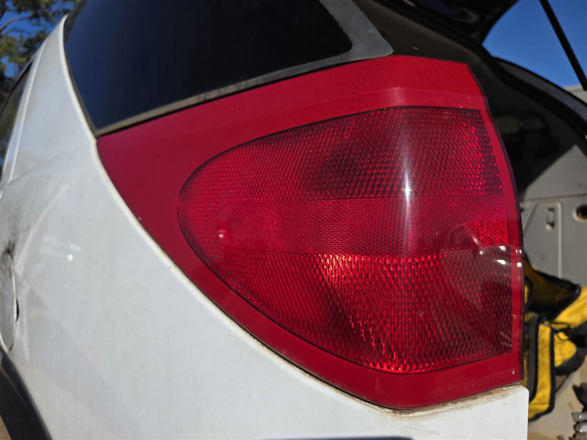 Used OEM Driver Side Left Tail Light Lamp Assembly from 2003 Buick Rendezvous