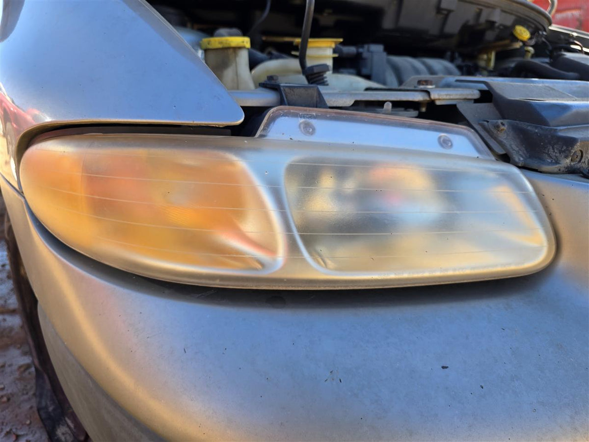 Used OEM Passenger Side Right Headlight Headlamp Assembly from 1996 Jeep Voyager