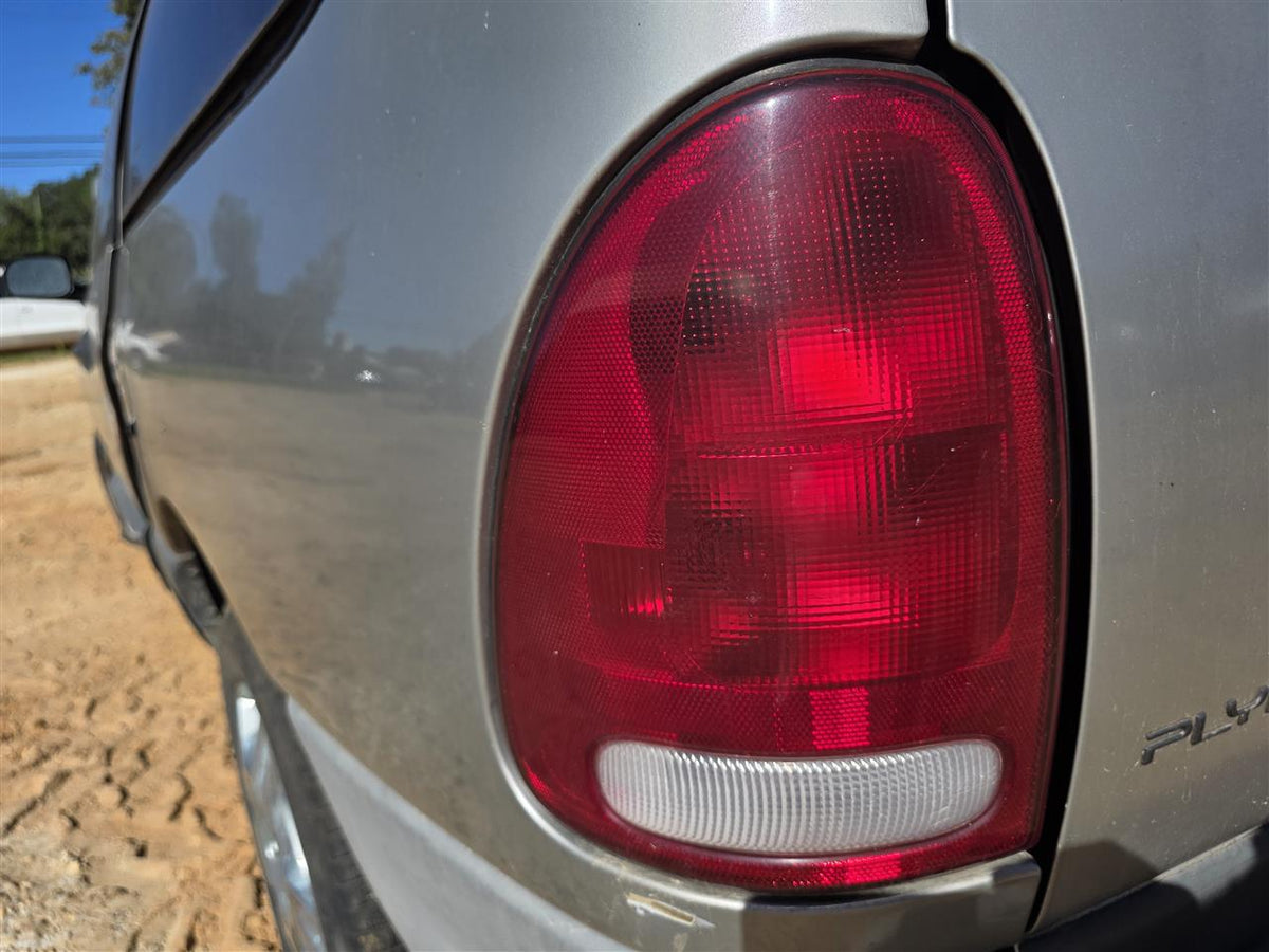 Used OEM Driver Side Left Tail Light Lamp Assembly from 1996 Jeep Voyager